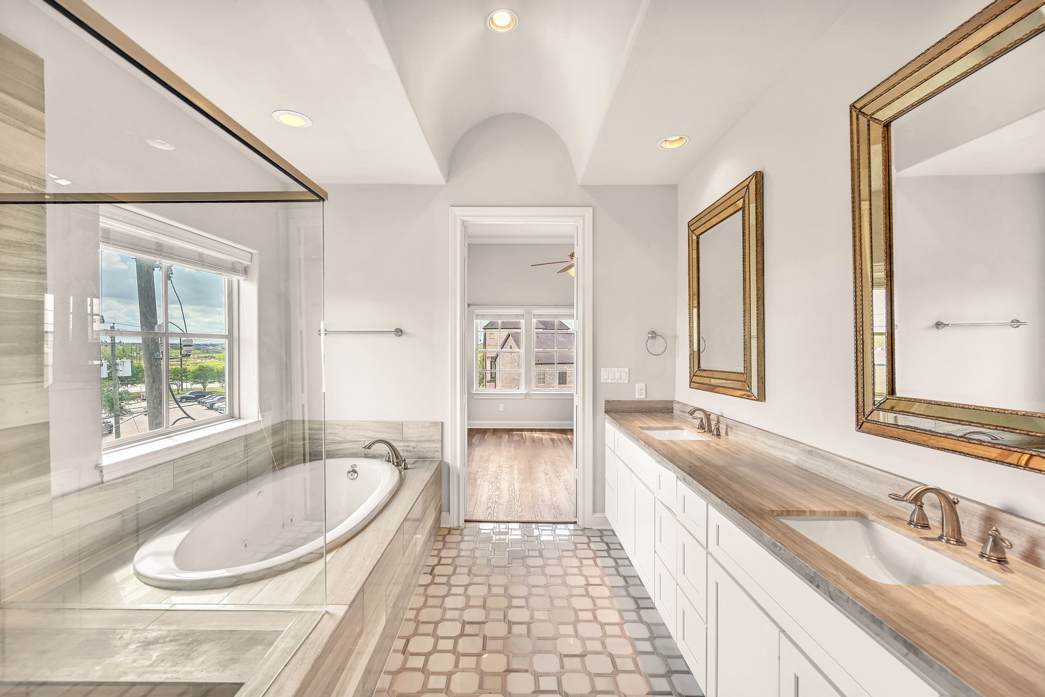 9644 Knight Road Houston, TX 77045 - Photo 19 of 28 a bathroom with a granite countertop sink and a bathtub