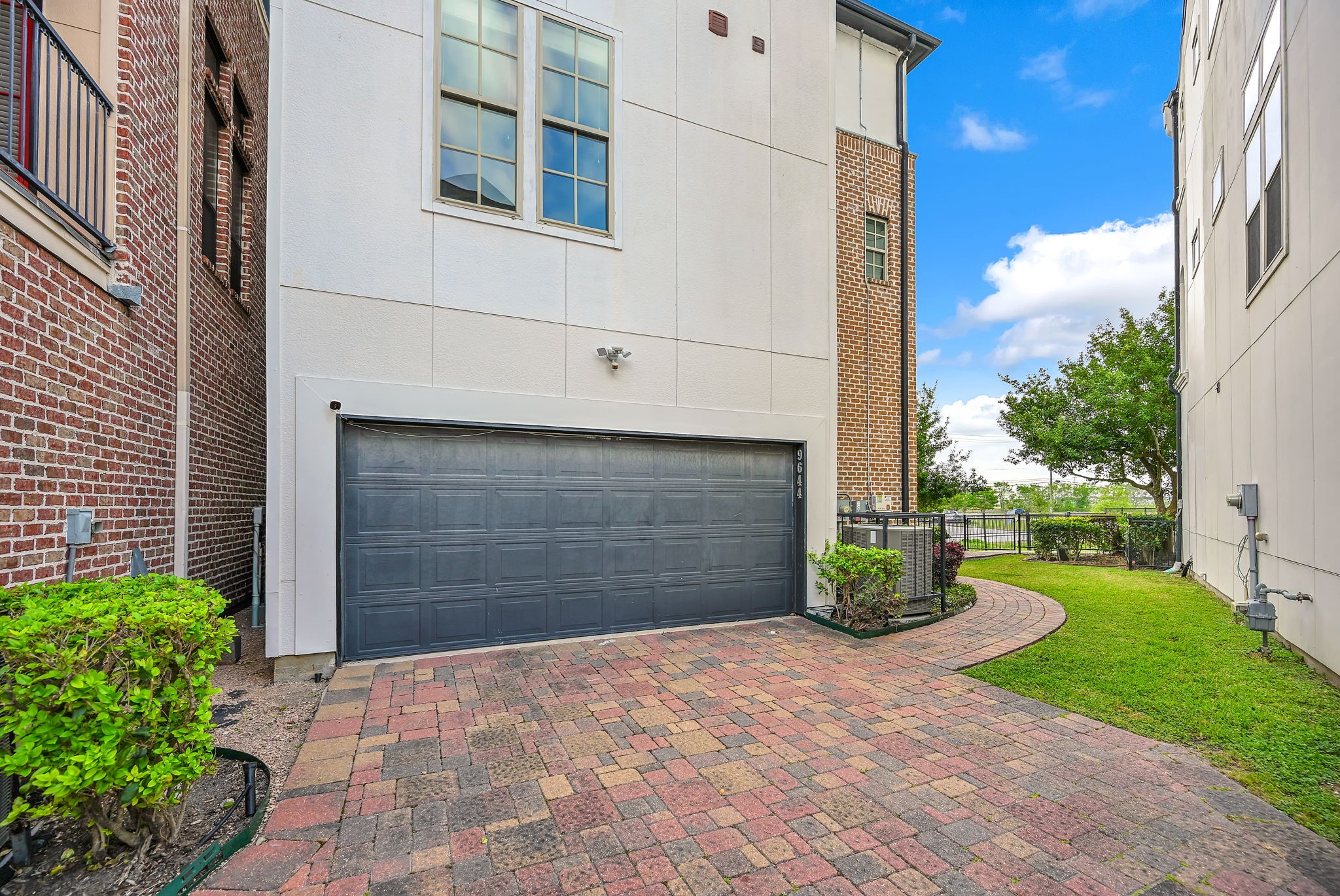 9644 Knight Road Houston, TX 77045 - Photo 23 of 28 a front view of a house with garden