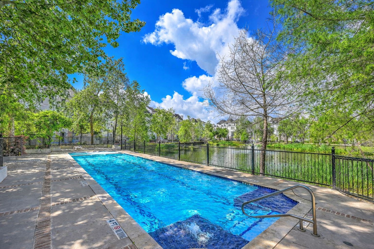 9644 Knight Road Houston, TX 77045 - Photo 27 of 28 a view of a lake with a floor to ceiling window and a basket ball court