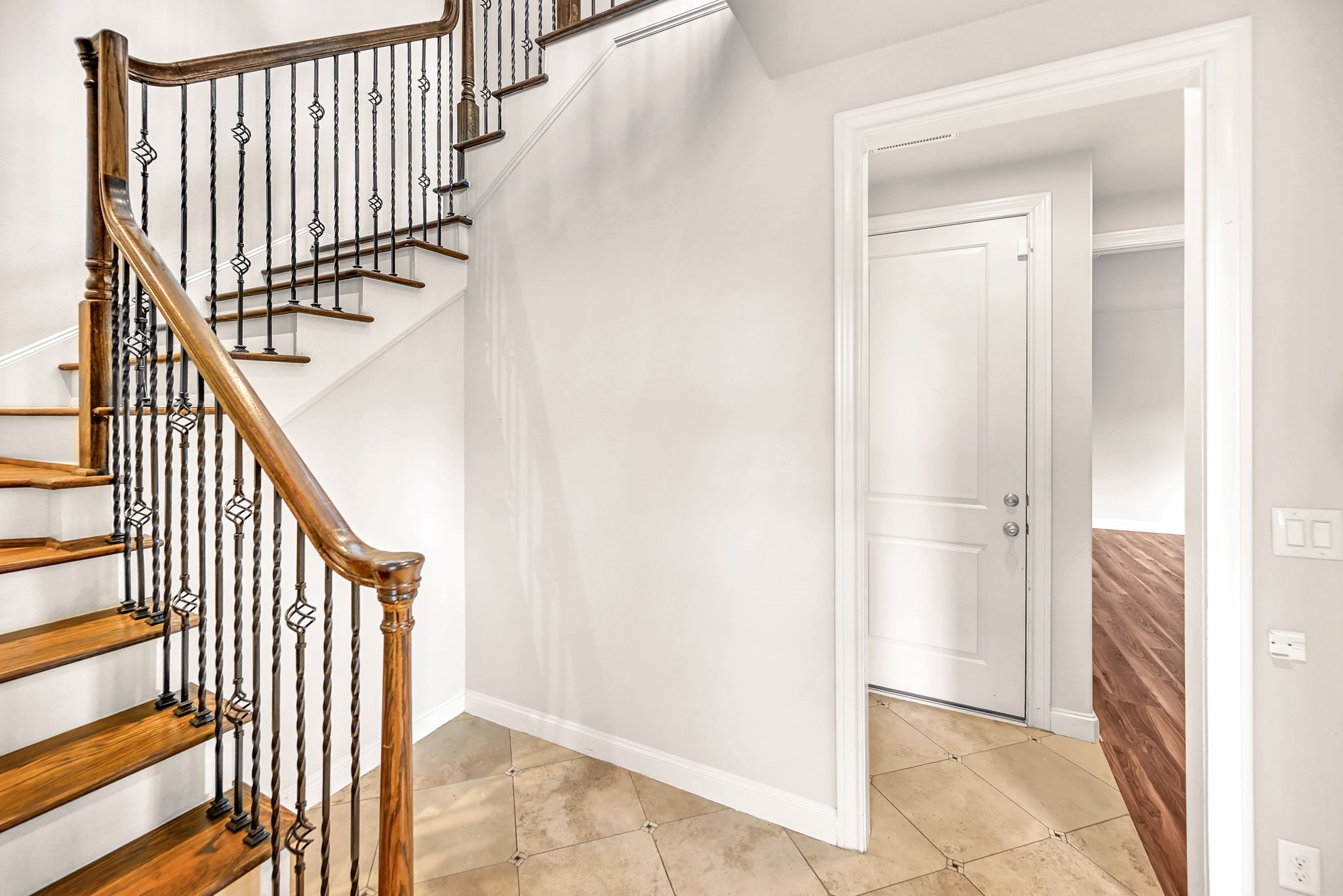 9644 Knight Road Houston, TX 77045 - Photo 4 of 28 a view of entryway with wooden floor and stairs