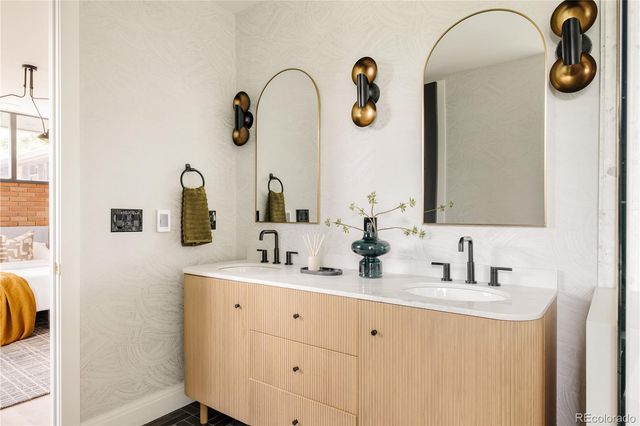 a bathroom with a sink and mirror