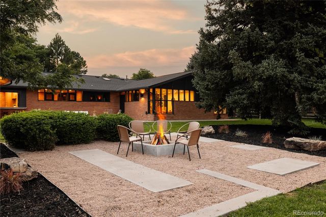 a view of a chairs and table in patio