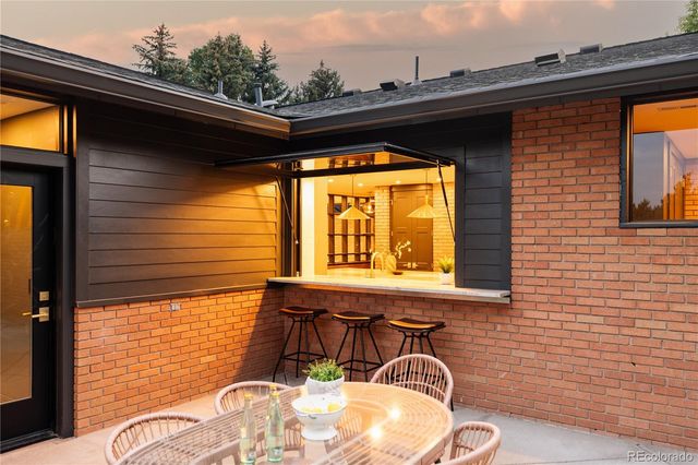 a view of a chair and table in the balcony