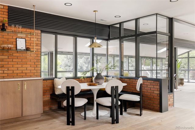 a view of a dining room with furniture window and outside view