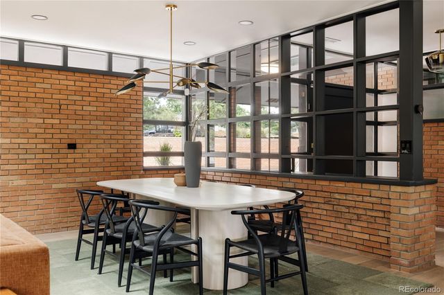 a dining room with a table and chairs