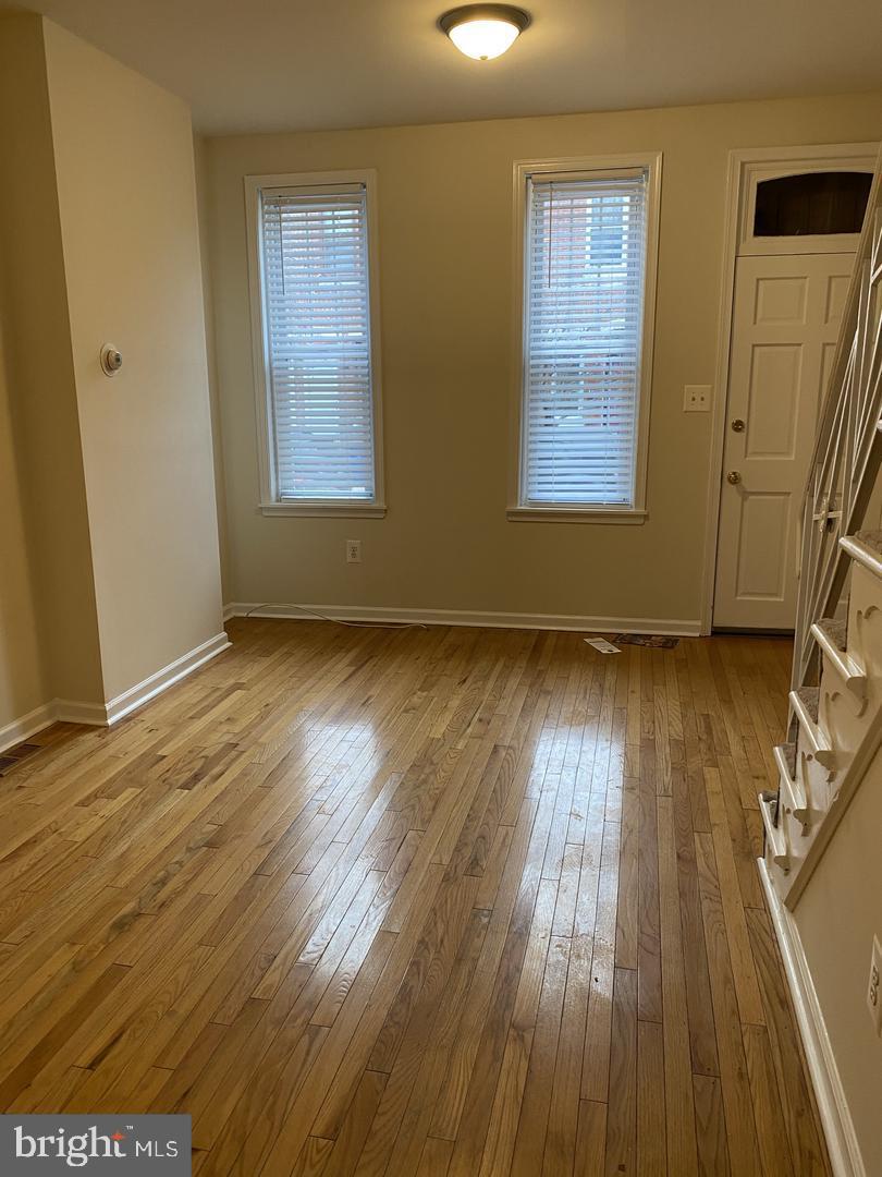 460 Moyer Street Philadelphia, PA 19125 - Photo 3 of 10 a view of an empty room with wooden floor and a window