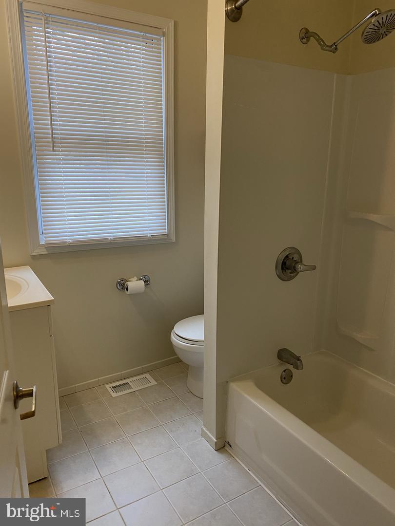 460 Moyer Street Philadelphia, PA 19125 - Photo 10 of 10 a bathroom with a toilet and a tub
