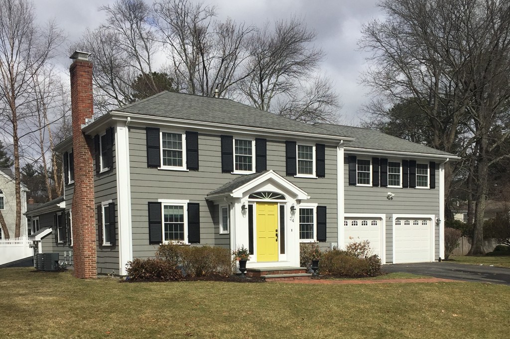 34 Oxford Road Wellesley, MA 02481 - Photo 1 of 14 a front view of a house with a yard