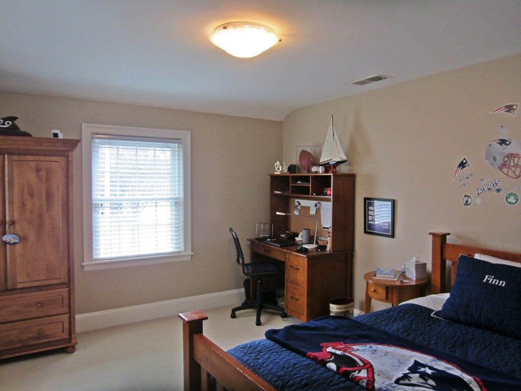 34 Oxford Road Wellesley, MA 02481 - Photo 11 of 14 a bedroom with a bed and furniture