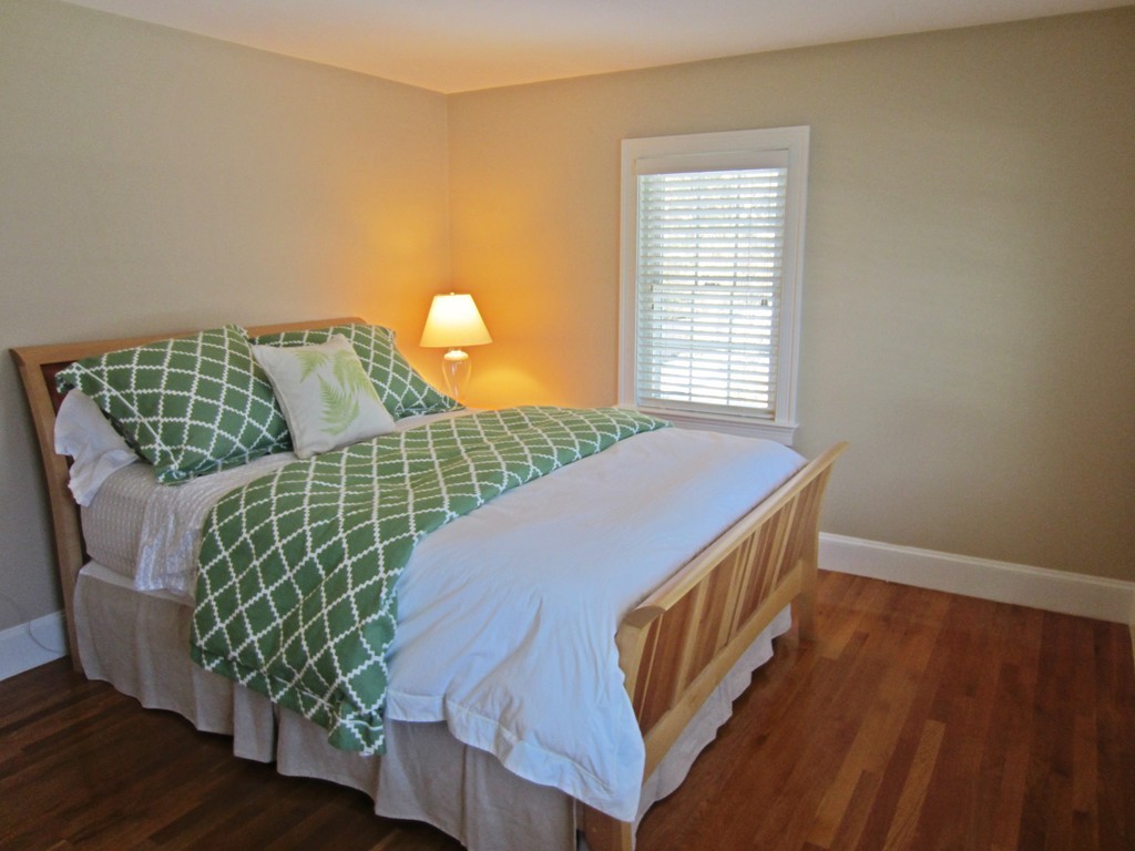 34 Oxford Road Wellesley, MA 02481 - Photo 12 of 14 a bedroom with a bed and a night stand with wooden floor