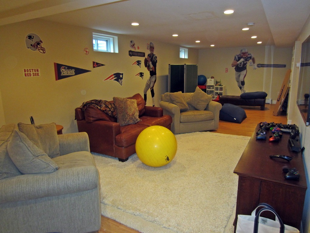 34 Oxford Road Wellesley, MA 02481 - Photo 14 of 14 a living room with furniture and a gym machine