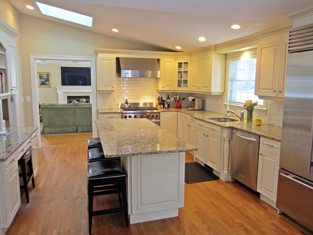 34 Oxford Road Wellesley, MA 02481 - Photo 4 of 14 a kitchen with a sink a counter top space stainless steel appliances and a window