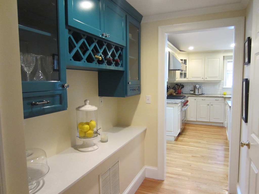 34 Oxford Road Wellesley, MA 02481 - Photo 6 of 14 a kitchen with a sink a stove and cabinets