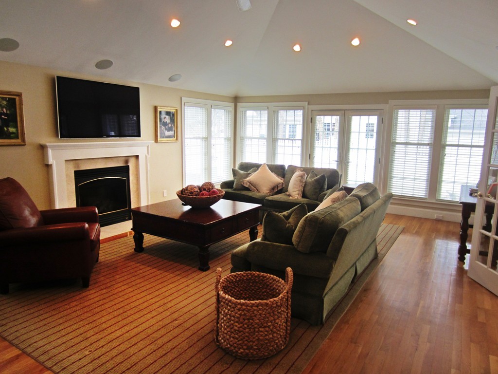 34 Oxford Road Wellesley, MA 02481 - Photo 8 of 14 a living room with furniture and a fireplace