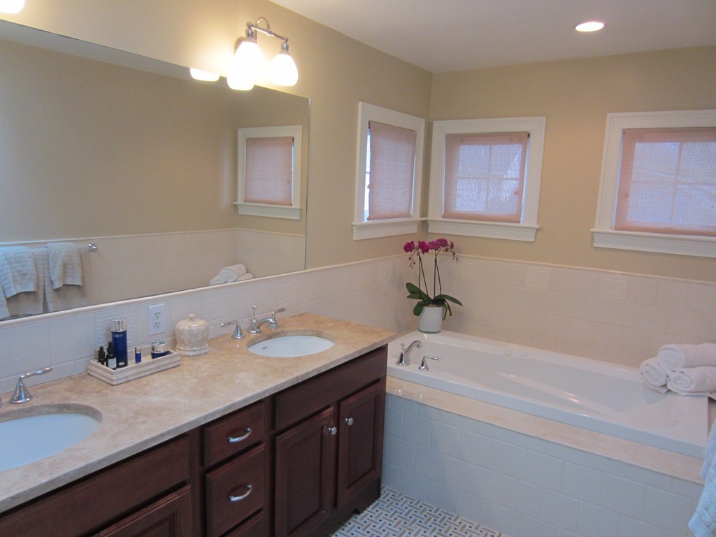 34 Oxford Road Wellesley, MA 02481 - Photo 10 of 14 a bathroom with a tub sink and mirror