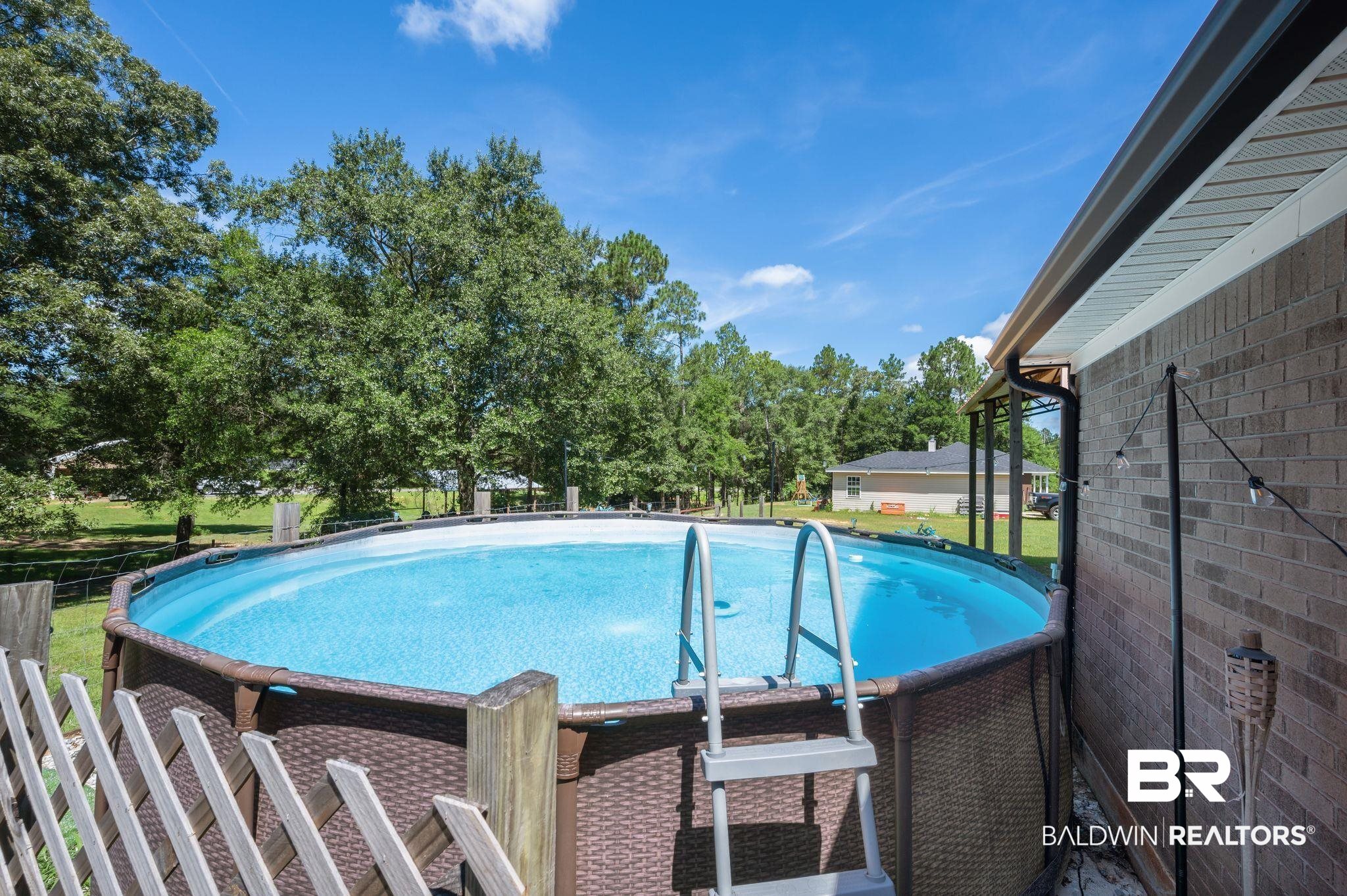 52923 Ammons Road Perdido, AL 36562 - Photo 28 of 35 Outdoor pool with view of wooded area