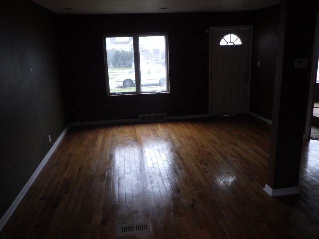 3756 West 85th Place Chicago, IL 60652 - Photo 4 of 19 a view of an empty room and wooden floor