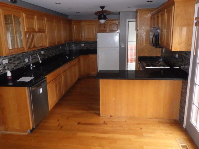 3756 West 85th Place Chicago, IL 60652 - Photo 9 of 19 a kitchen with stainless steel appliances a refrigerator and a stove