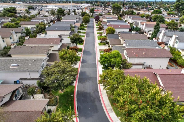 an aerial view of residential houses with outdoor space