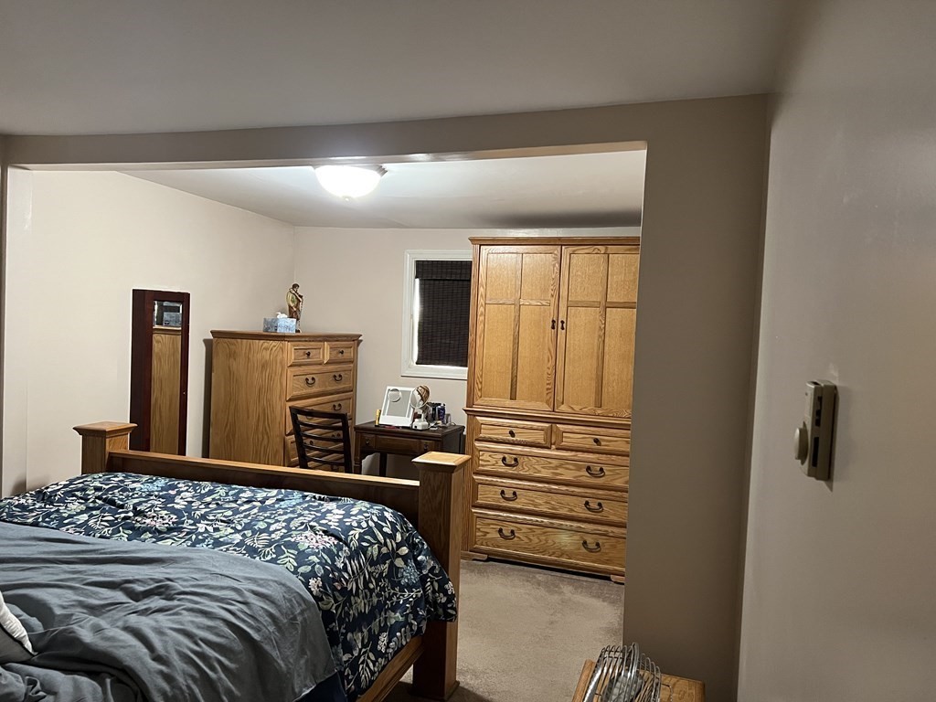 33 Merrill Road Springfield, MA 01119 - Photo 13 of 18 a bedroom with a bed and furniture