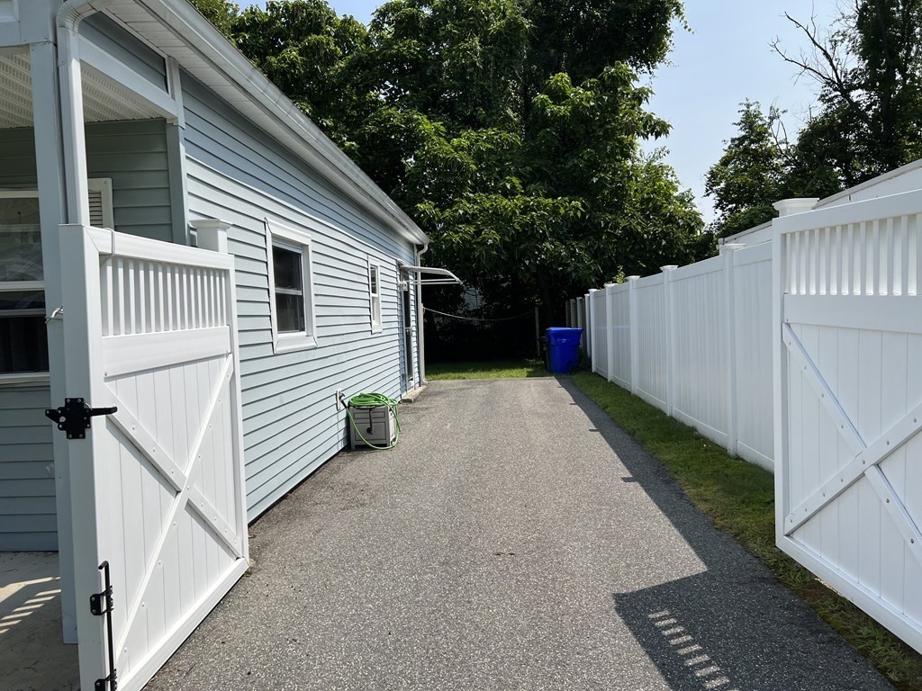 33 Merrill Road Springfield, MA 01119 - Photo 4 of 18 a view of a house with backyard and trees