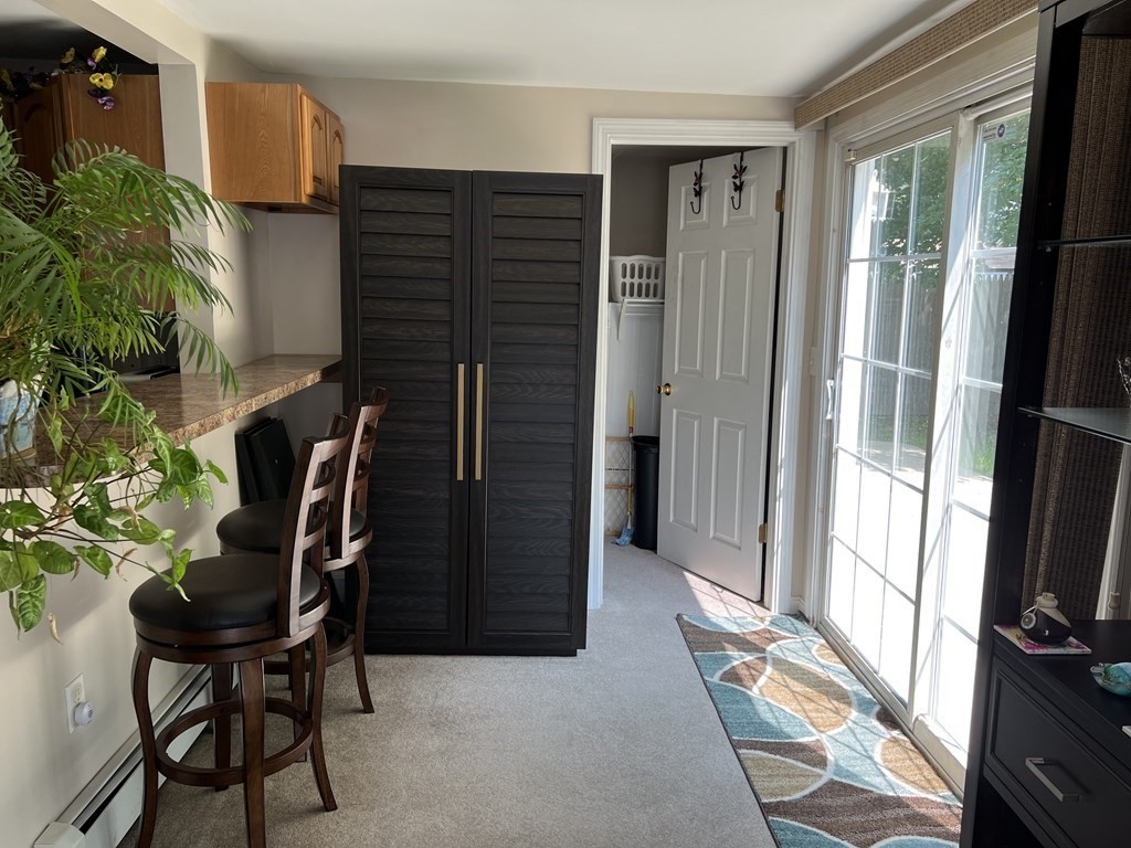 33 Merrill Road Springfield, MA 01119 - Photo 7 of 18 a view of a workspace room with furniture and a window