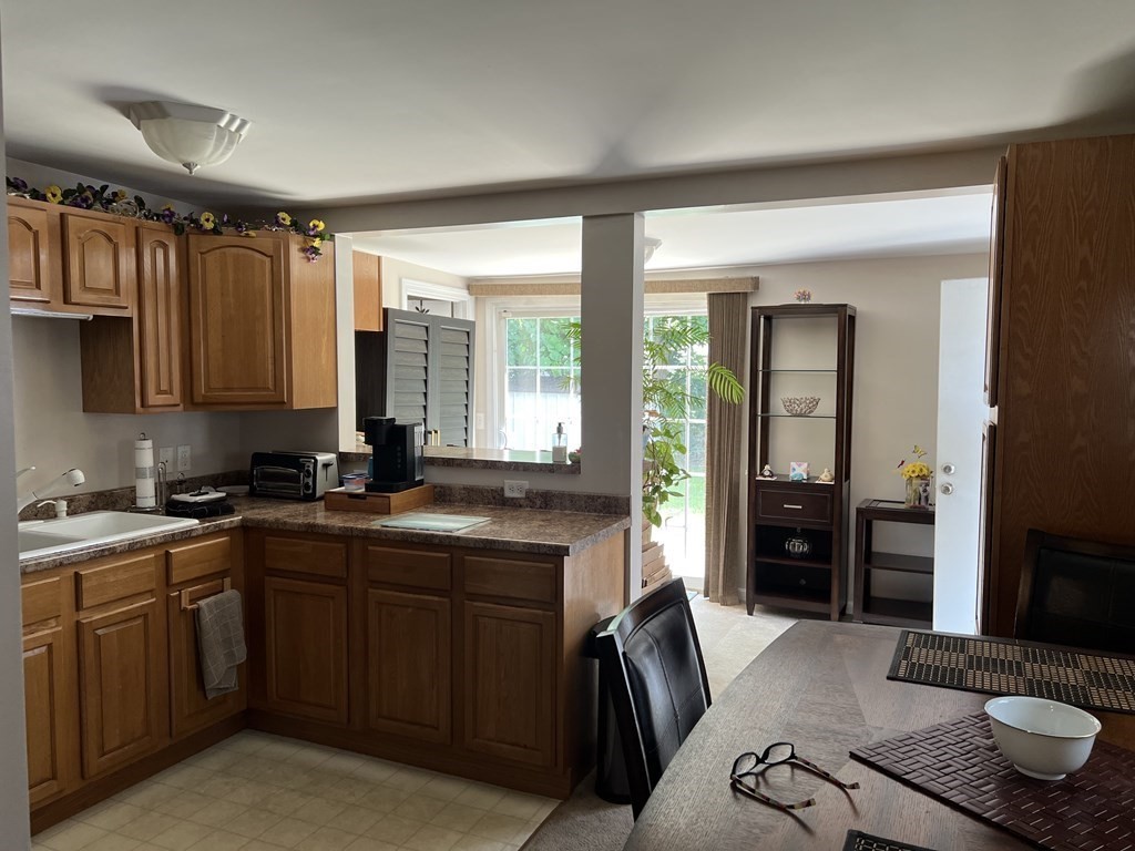 33 Merrill Road Springfield, MA 01119 - Photo 8 of 18 a kitchen with a sink stove and cabinets