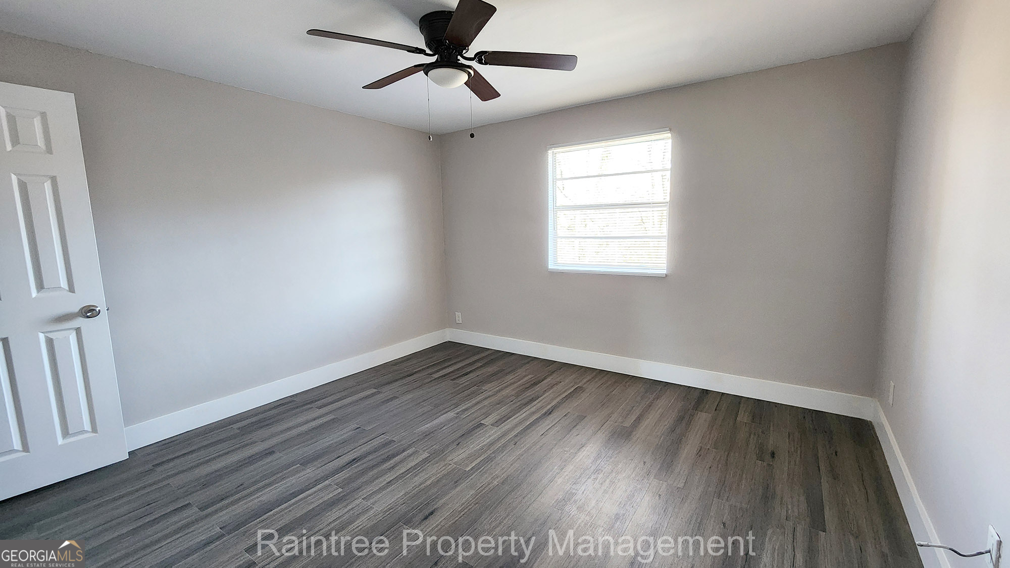 20 Griffin Street Northwest, Unit 12 Atlanta, GA 30314 - Photo 7 of 10 a view of empty room with wooden floor and fan