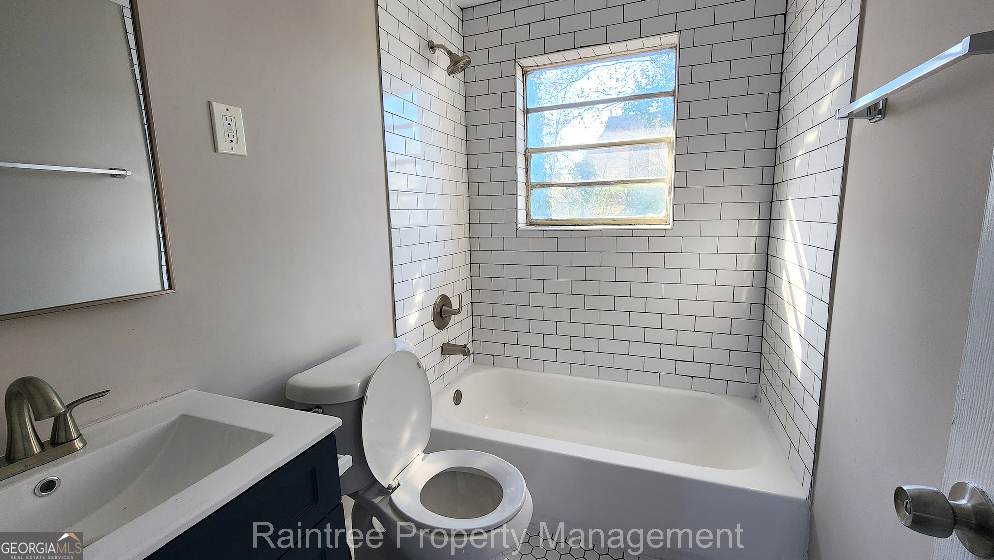 20 Griffin Street Northwest, Unit 12 Atlanta, GA 30314 - Photo 9 of 10 a bathroom with a sink a toilet and bathtub