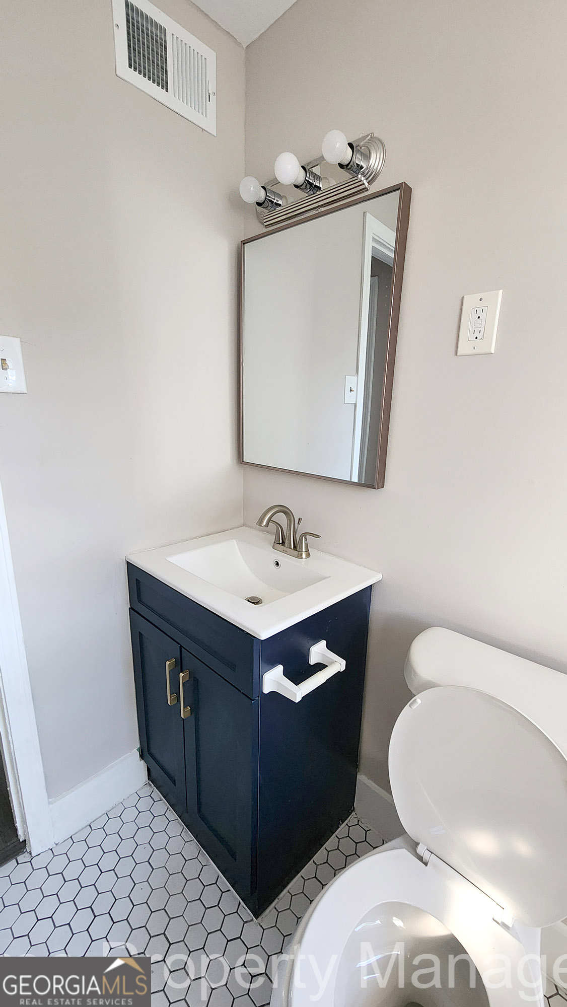 20 Griffin Street Northwest, Unit 12 Atlanta, GA 30314 - Photo 10 of 10 a bathroom with a sink vanity and toilet