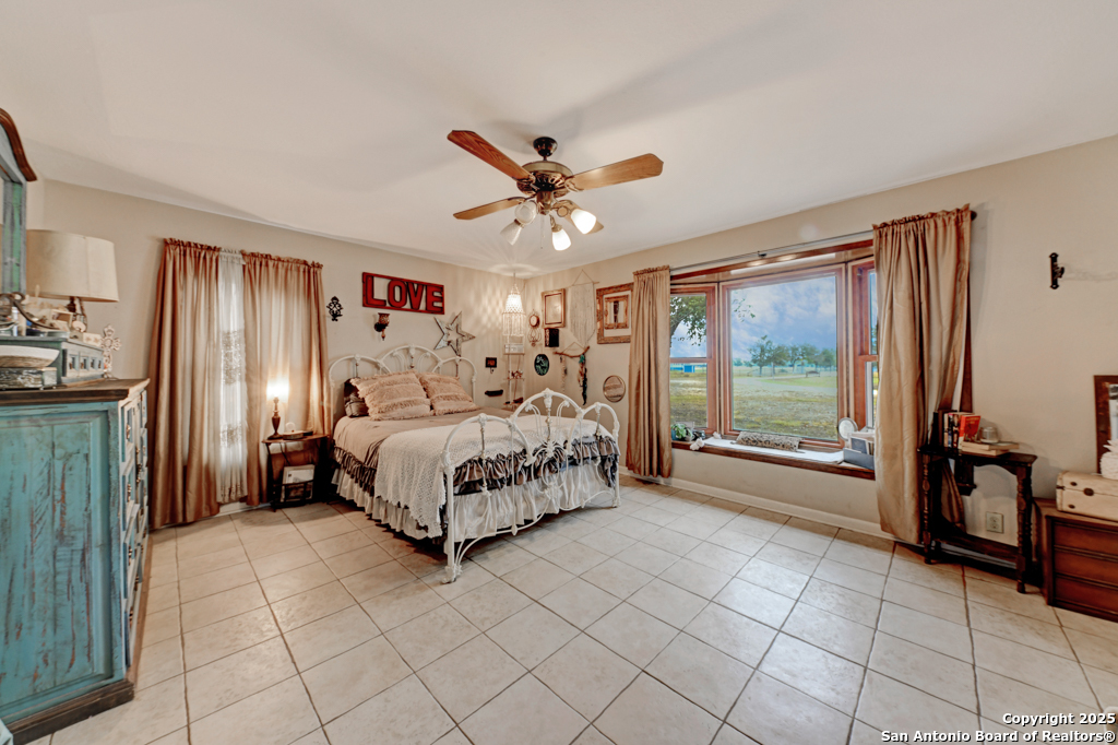 3136 Bolton Road Marion, TX 78124 - Photo 12 of 46 a bedroom with a bed and a large window