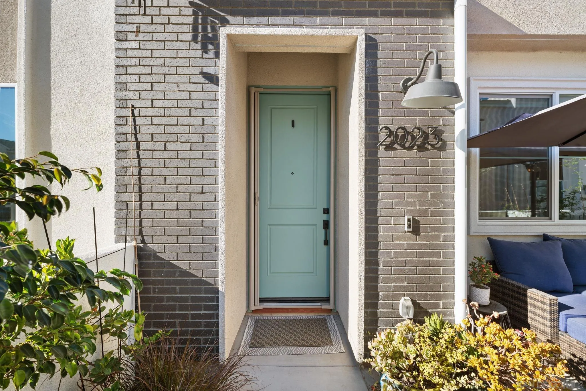 a front view of a house with a glass door
