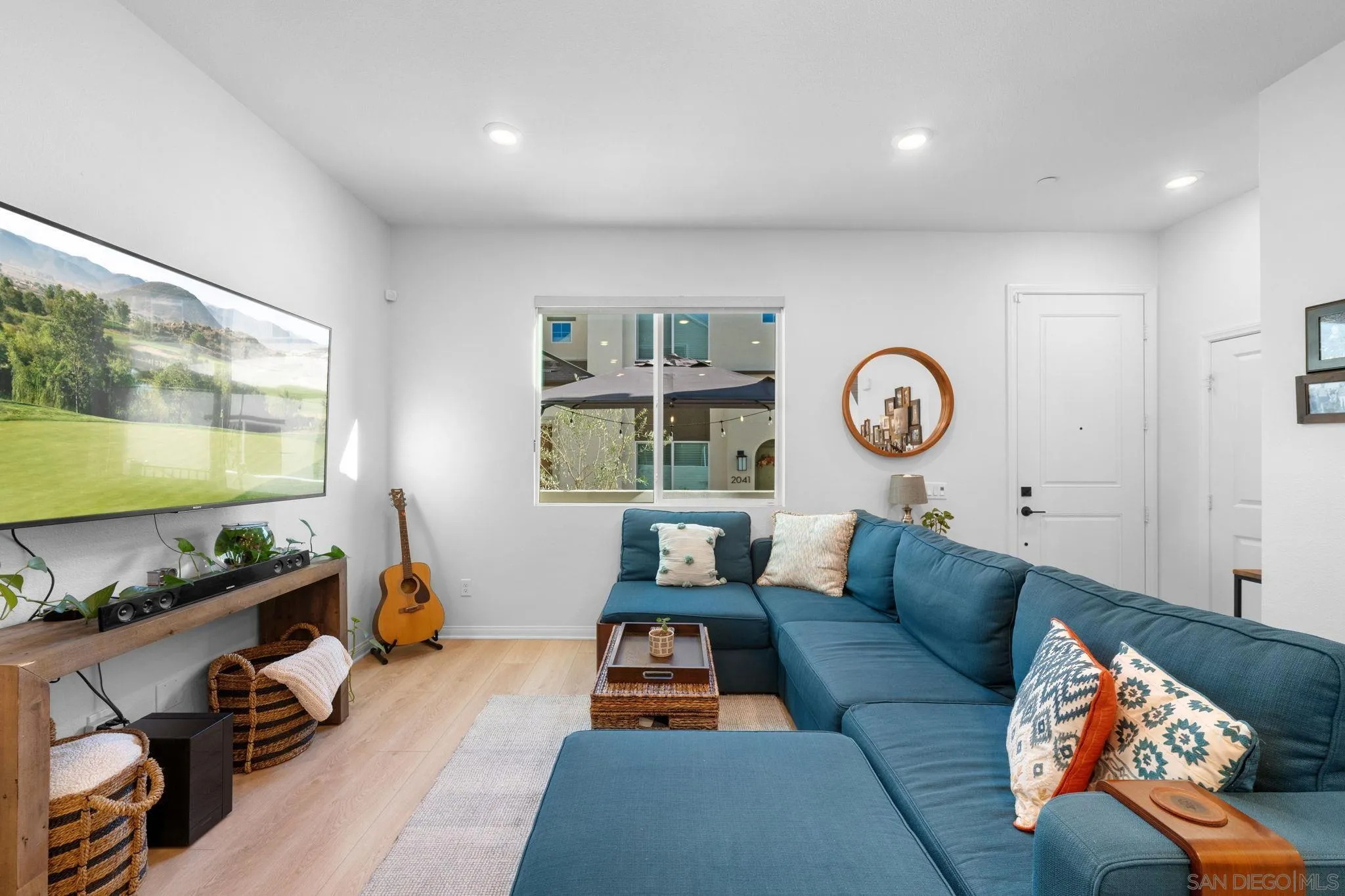 2023 Bluestone Circle Chula Vista, CA 91913 - Photo 12 of 51 a living room with furniture and a large window