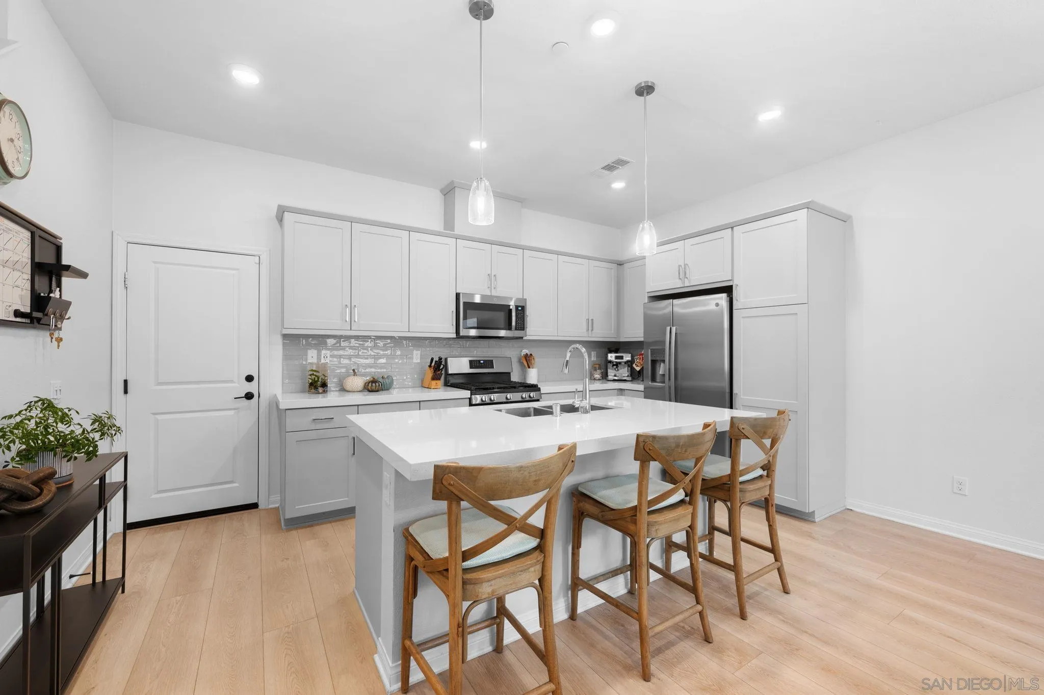 2023 Bluestone Circle Chula Vista, CA 91913 - Photo 14 of 51 a kitchen with refrigerator and cabinets