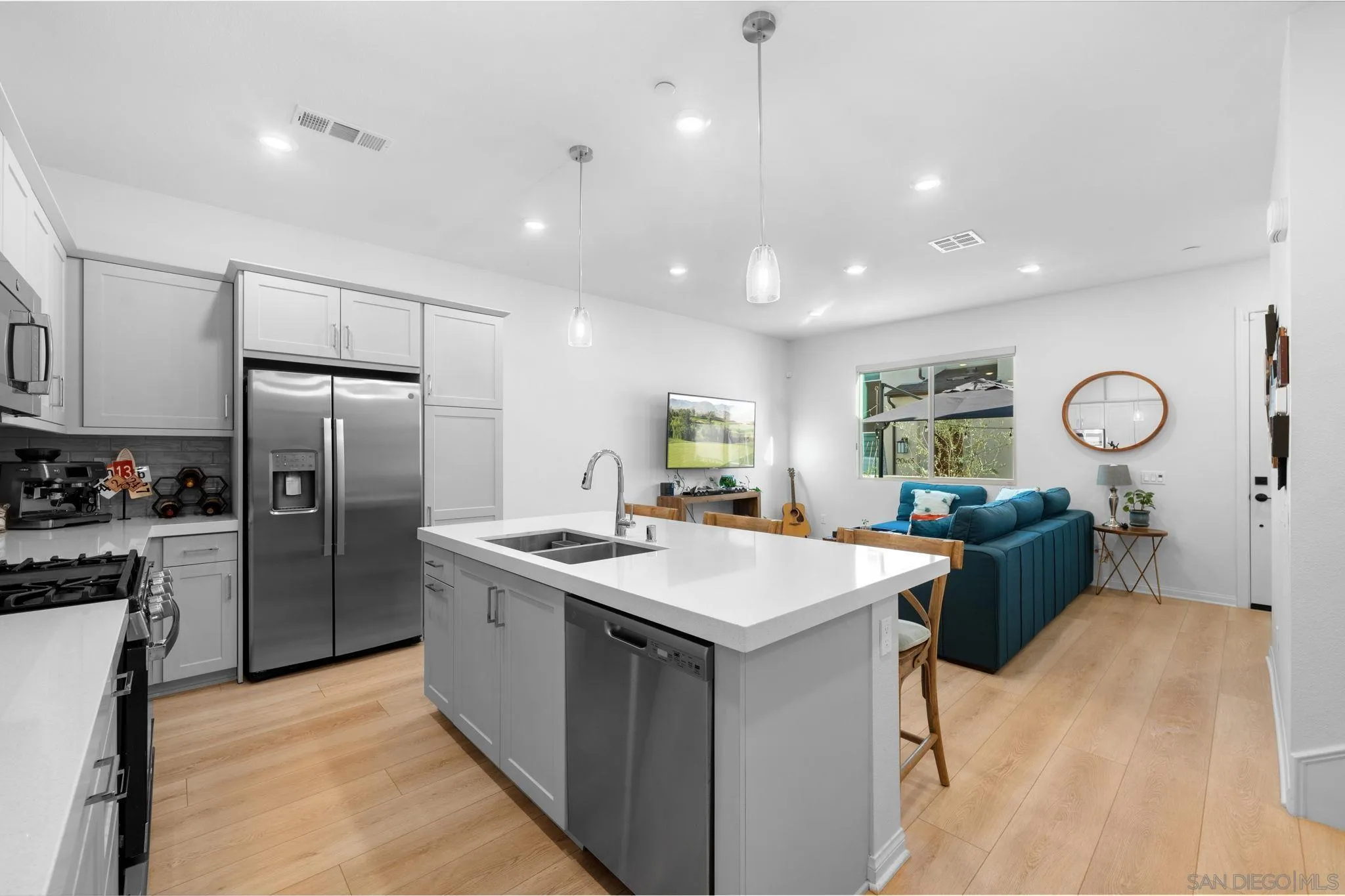 2023 Bluestone Circle Chula Vista, CA 91913 - Photo 20 of 51 a kitchen with a sink stainless steel appliances furniture and a window
