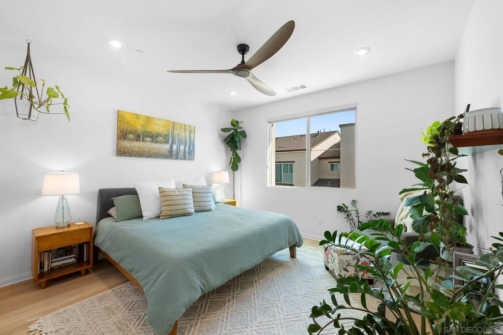 2023 Bluestone Circle Chula Vista, CA 91913 - Photo 23 of 51 a bedroom with a bed and a potted plant
