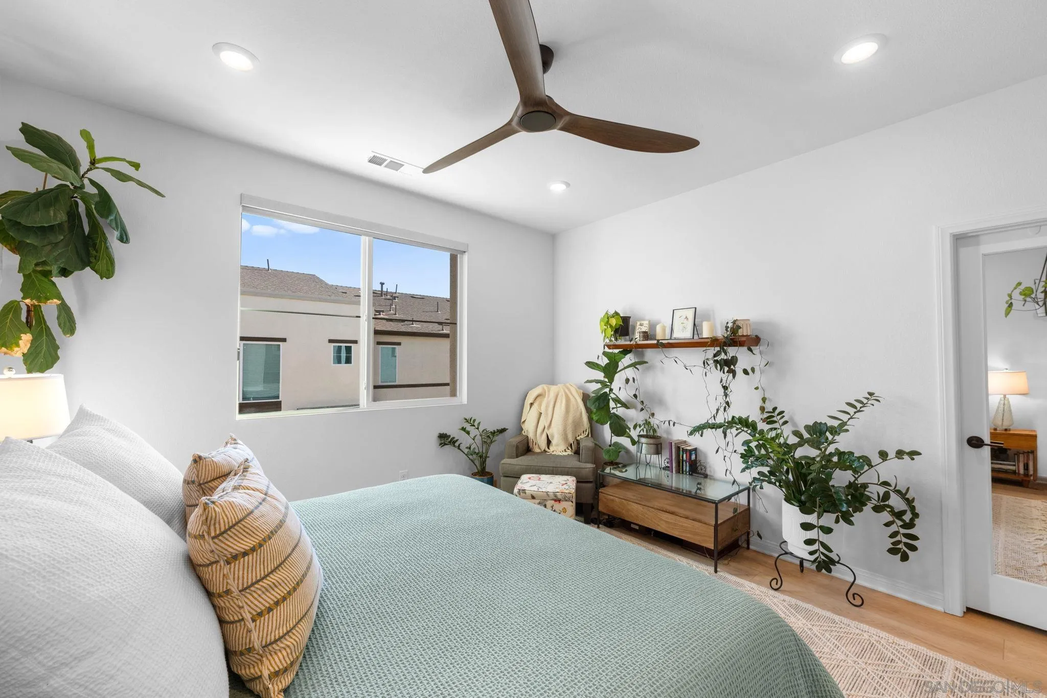 2023 Bluestone Circle Chula Vista, CA 91913 - Photo 25 of 51 a bedroom with furniture and a chandelier