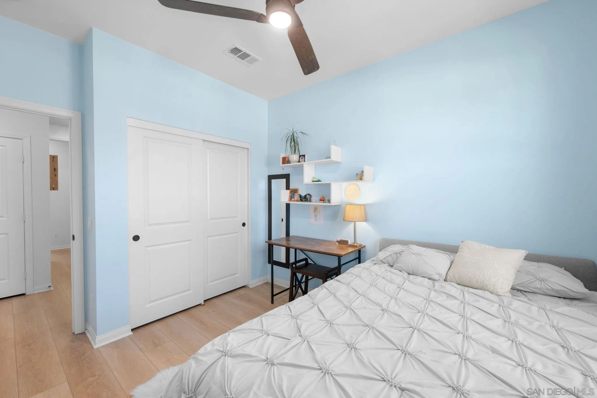 2023 Bluestone Circle Chula Vista, CA 91913 - Photo 27 of 51 a bedroom with a bed and wooden floor