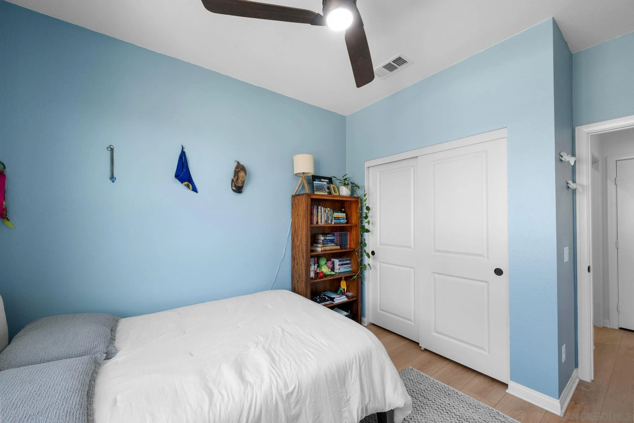 2023 Bluestone Circle Chula Vista, CA 91913 - Photo 29 of 51 a bedroom with a bed and a book shelf