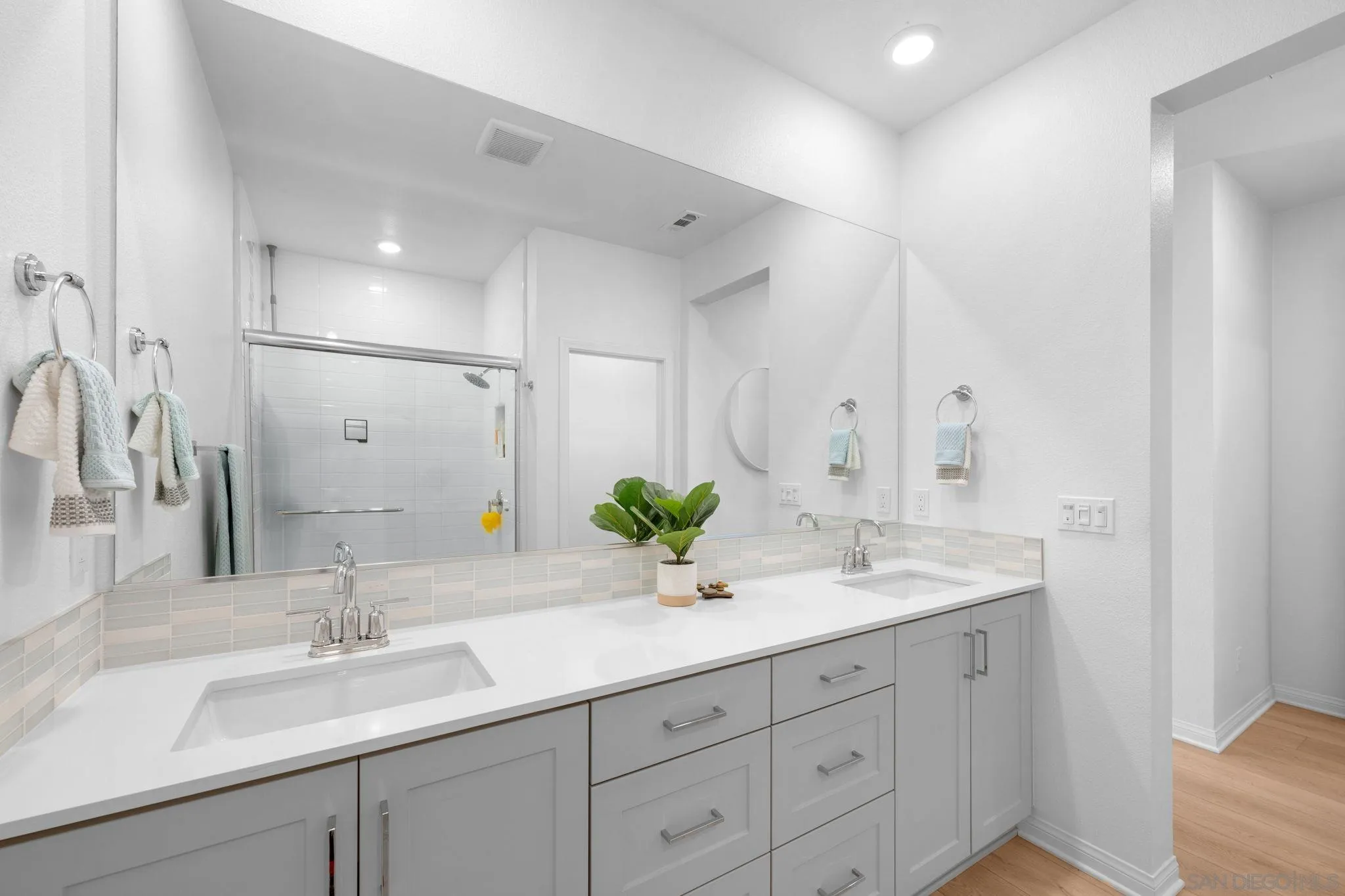 2023 Bluestone Circle Chula Vista, CA 91913 - Photo 31 of 51 a bathroom with a sink and a mirror