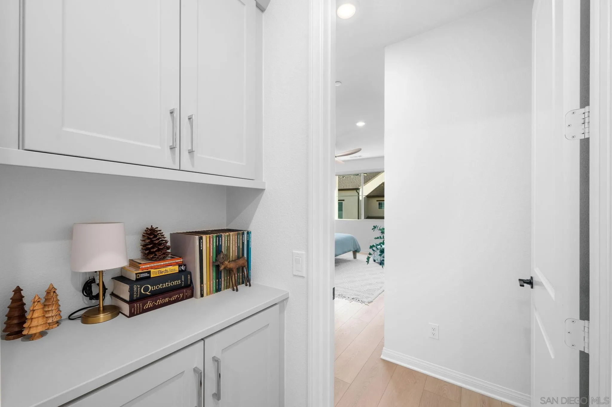 2023 Bluestone Circle Chula Vista, CA 91913 - Photo 36 of 51 a kitchen with a refrigerator and cabinets
