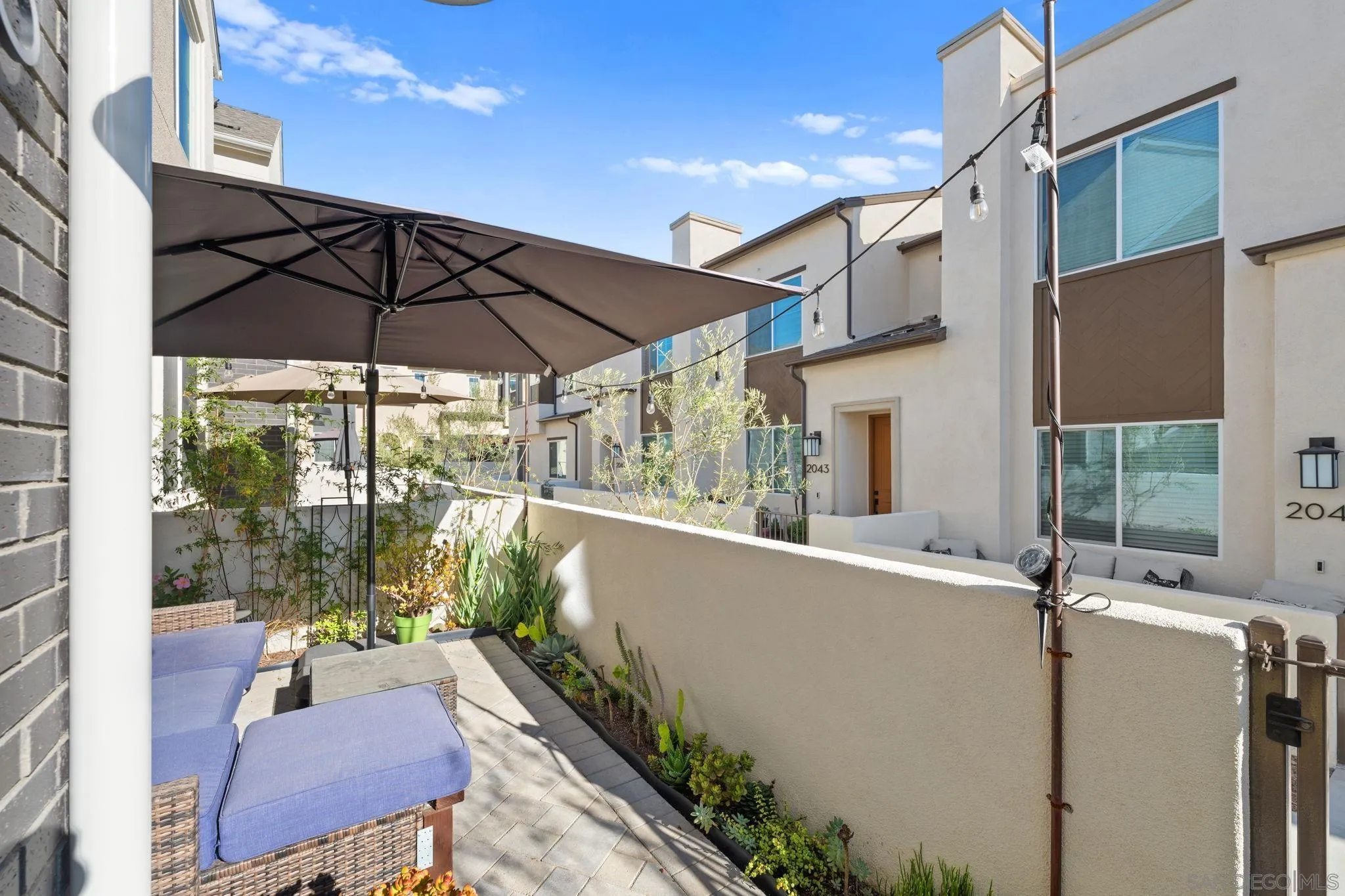 2023 Bluestone Circle Chula Vista, CA 91913 - Photo 5 of 51 a view of balcony with furniture and umbrella