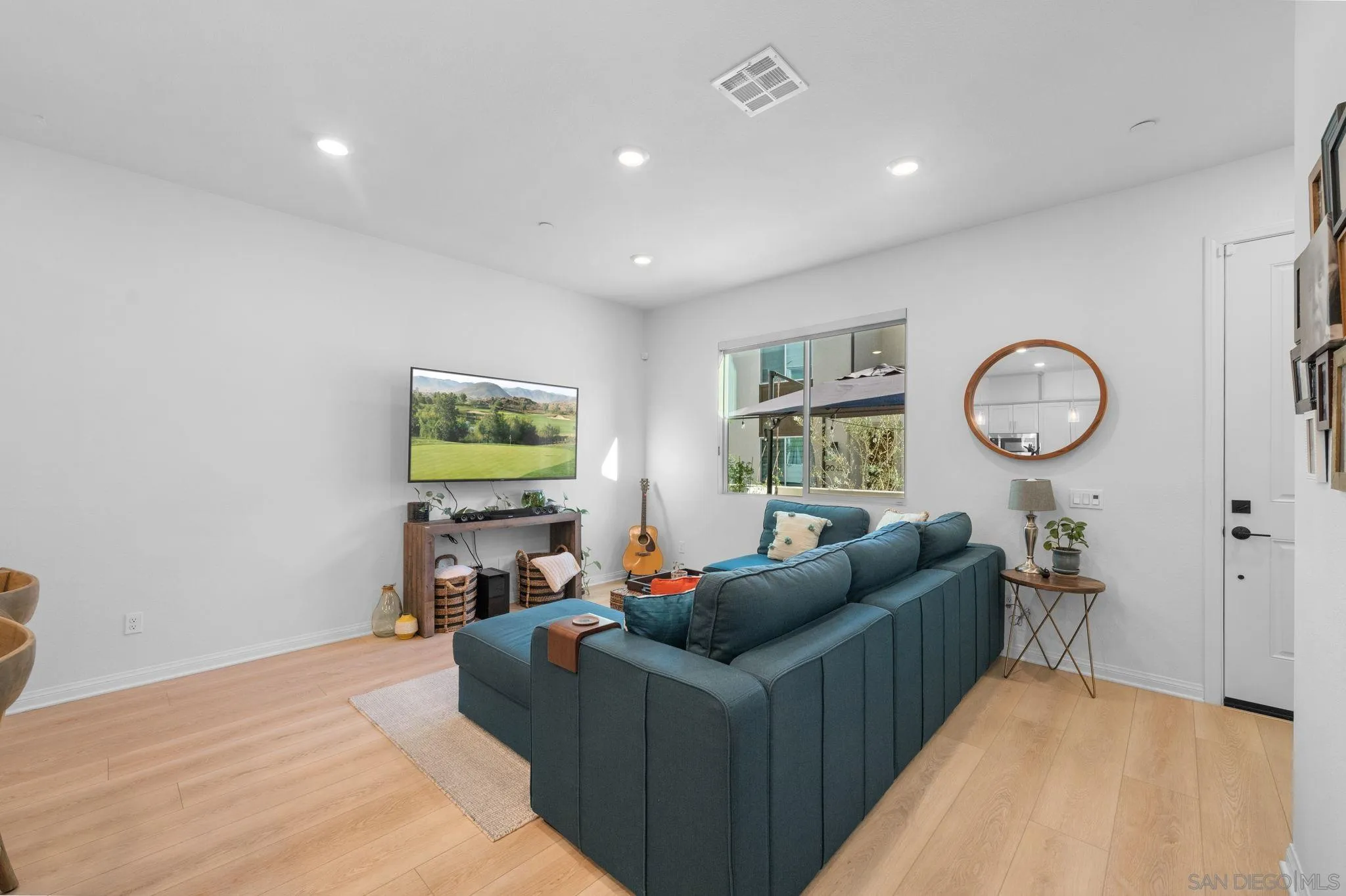 2023 Bluestone Circle Chula Vista, CA 91913 - Photo 8 of 51 a living room with furniture and a window
