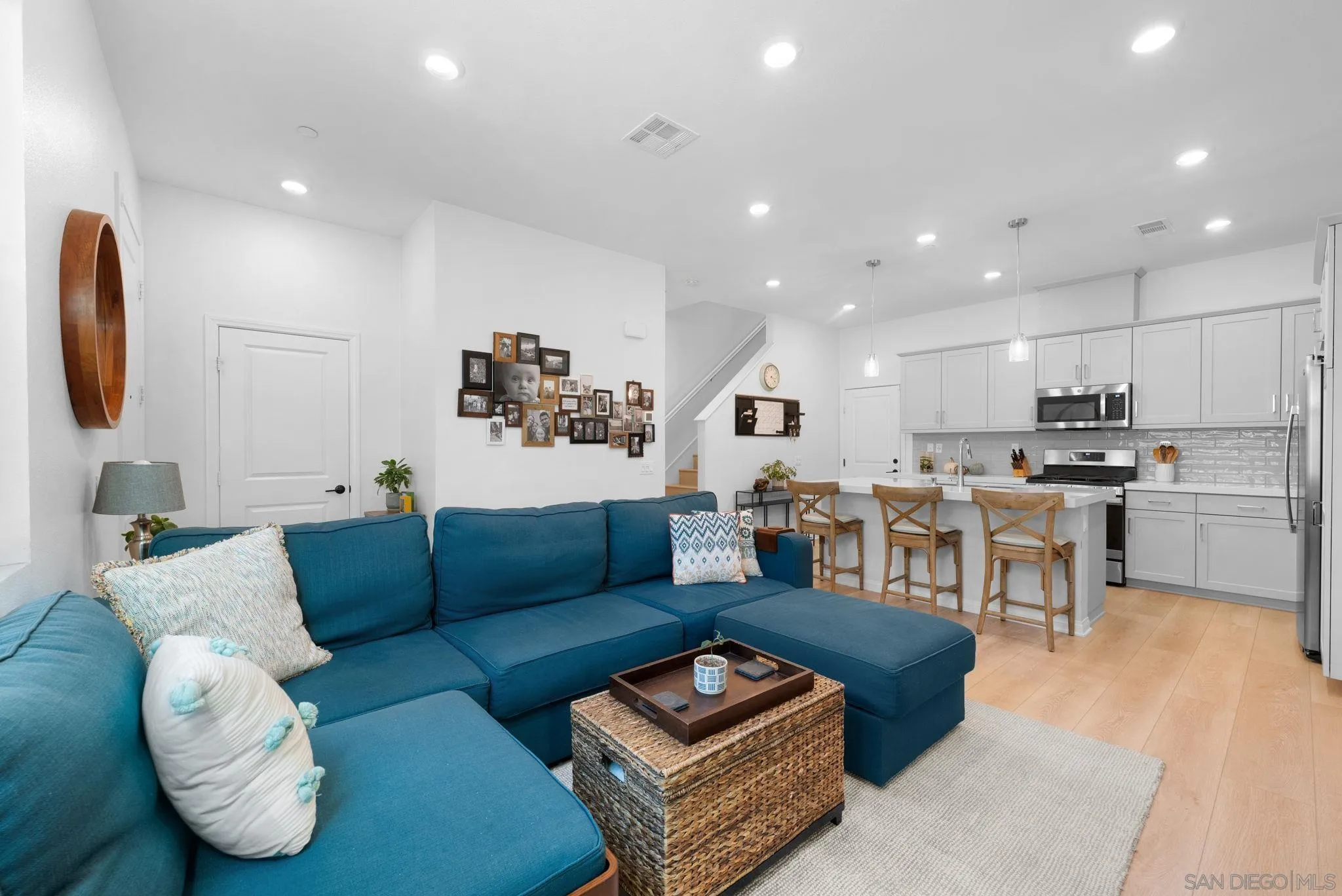 2023 Bluestone Circle Chula Vista, CA 91913 - Photo 10 of 51 a living room with furniture kitchen and a table