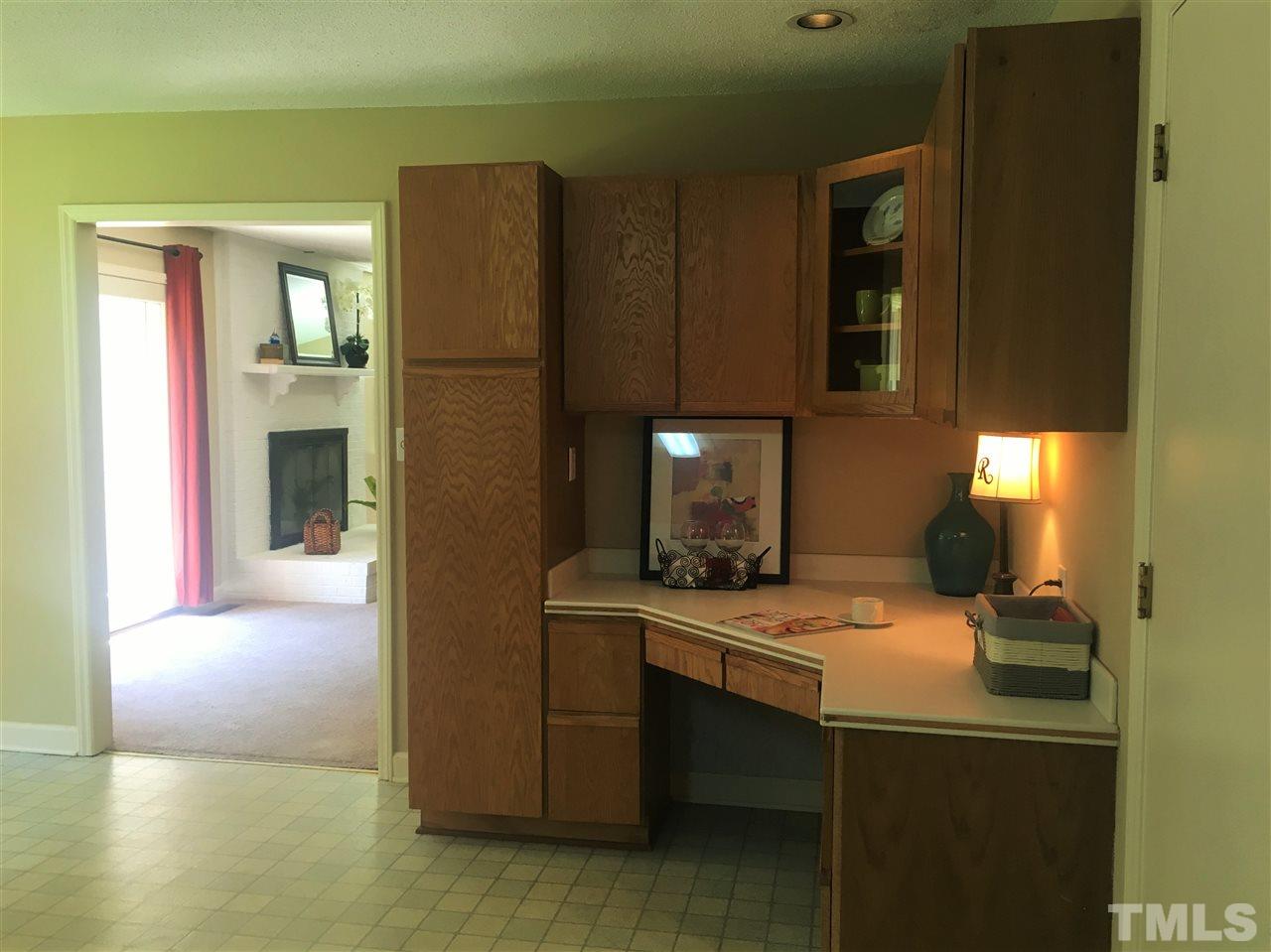 10200 Old Creedmoor Road Raleigh, NC 27613 - Photo 13 of 24 a kitchen with a sink cabinets and appliances