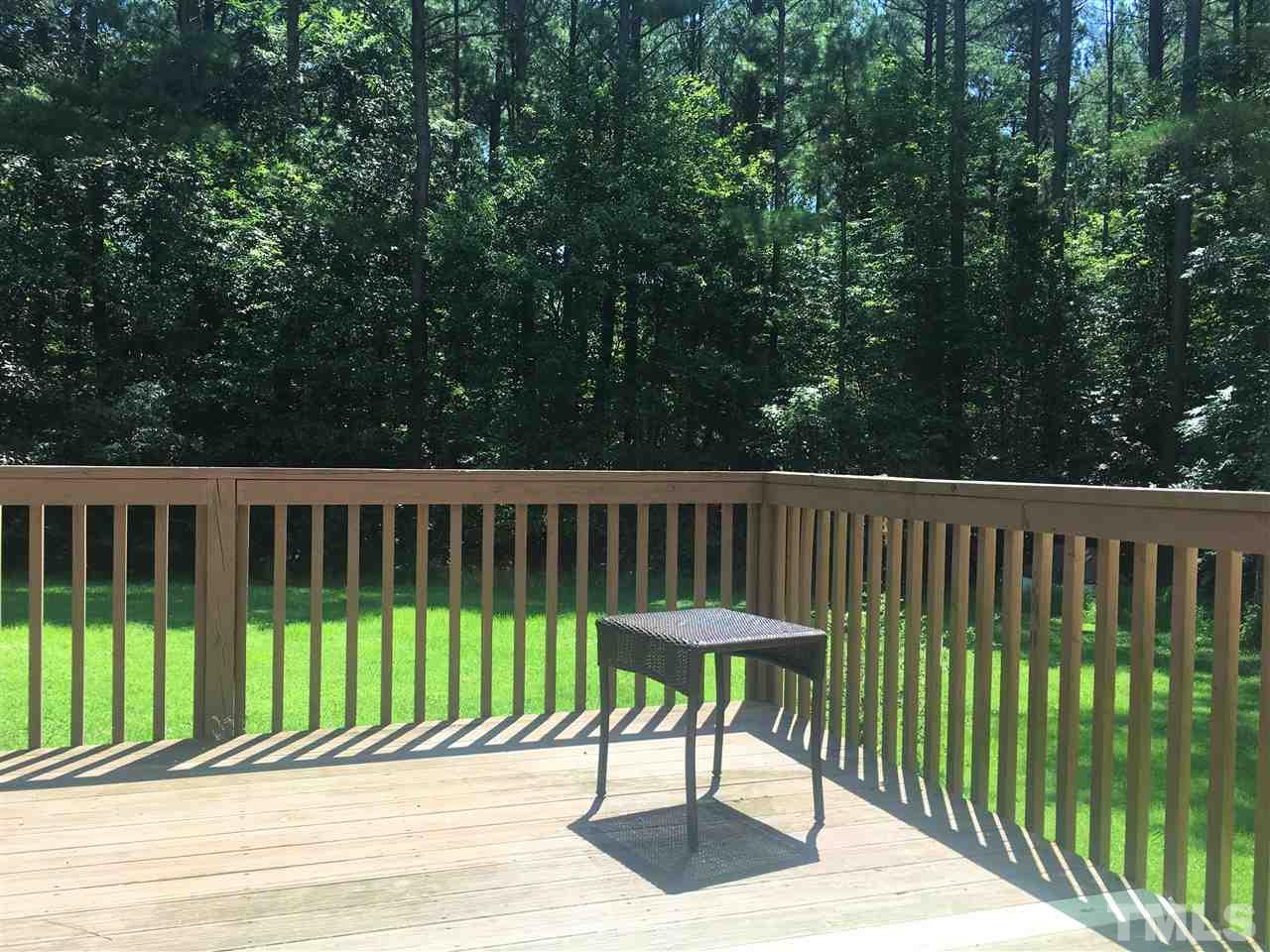 10200 Old Creedmoor Road Raleigh, NC 27613 - Photo 18 of 24 a view of a wooden bench on the side of a street