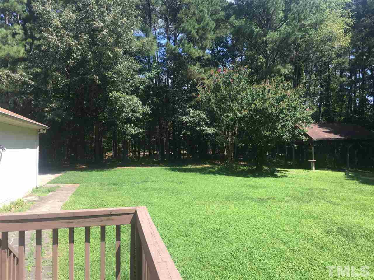 10200 Old Creedmoor Road Raleigh, NC 27613 - Photo 19 of 24 a view of a backyard with a garden