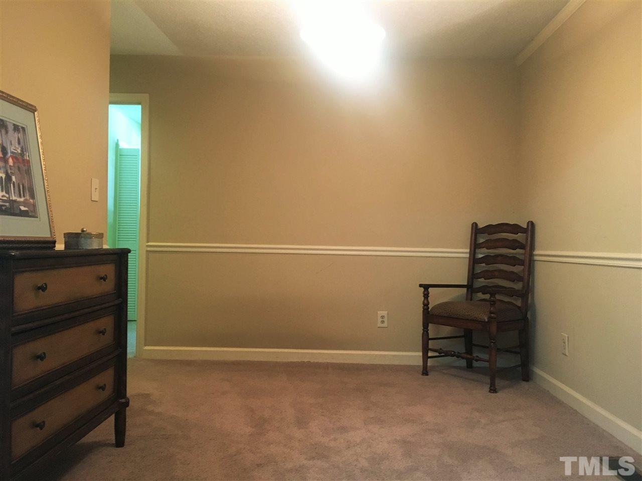 10200 Old Creedmoor Road Raleigh, NC 27613 - Photo 21 of 24 a room with a bench