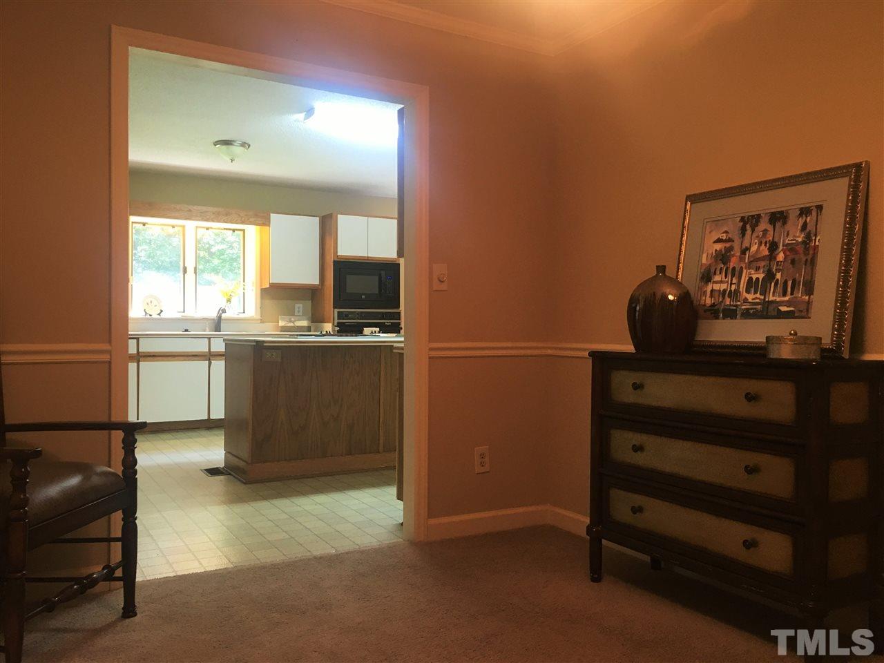 10200 Old Creedmoor Road Raleigh, NC 27613 - Photo 22 of 24 a kitchen with a refrigerator and a sink