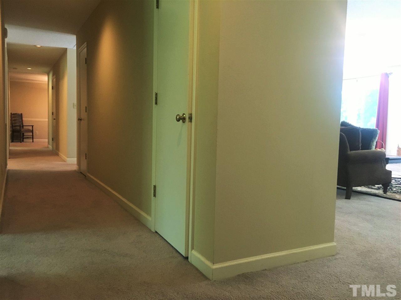 10200 Old Creedmoor Road Raleigh, NC 27613 - Photo 4 of 24 a view of a hallway and a livingroom with furniture